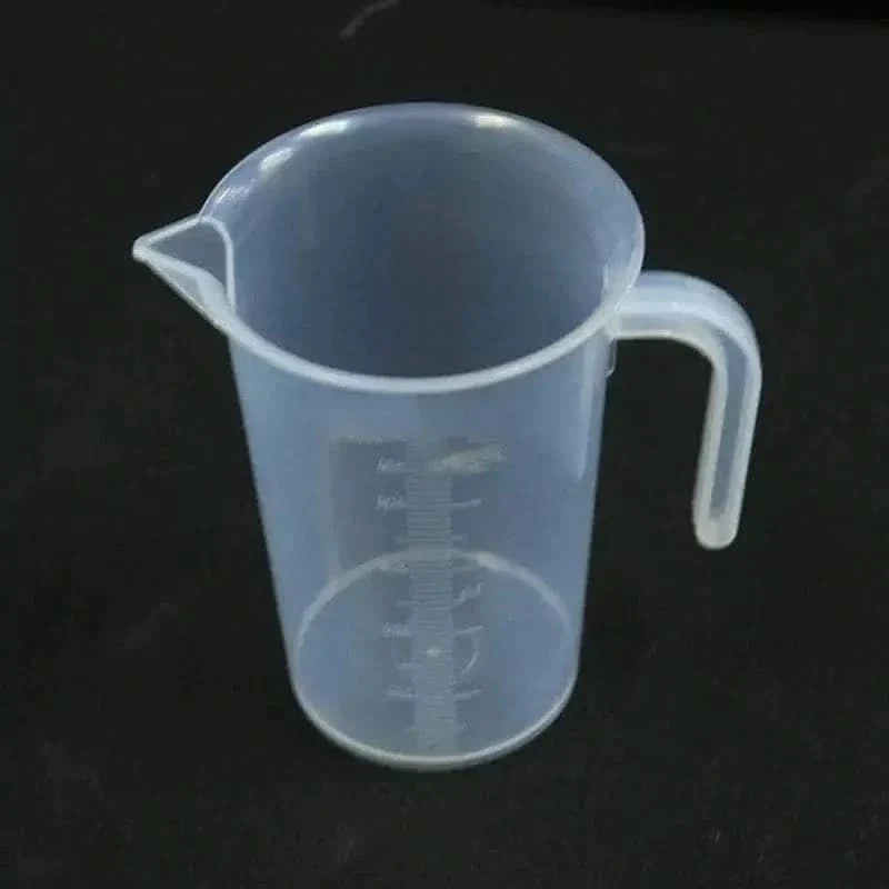 Translucent plastic measuring cup with handle.