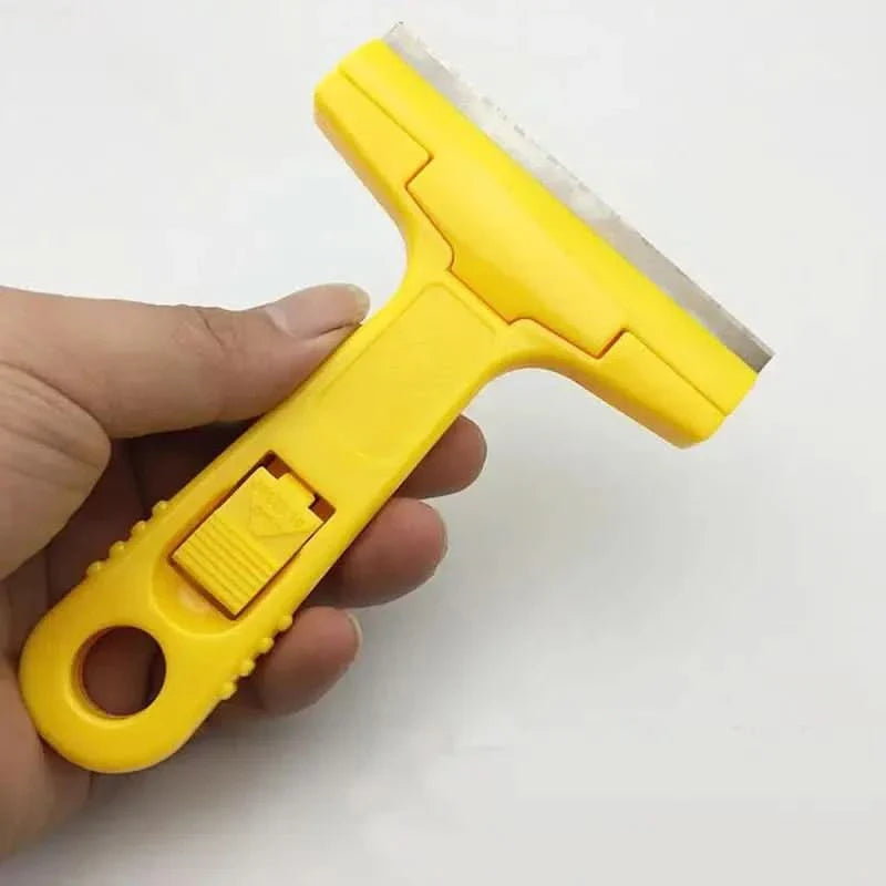 Yellow plastic scraper with blade.