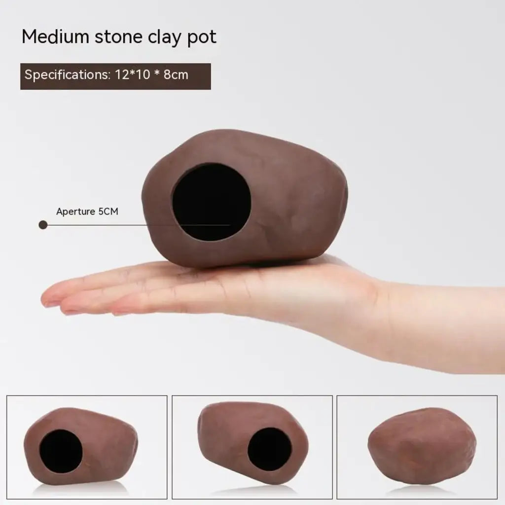 Brown stone-shaped clay pot with a circular opening.