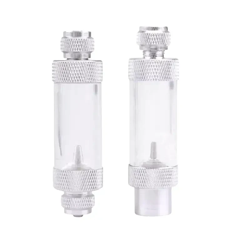 Two clear, cylindrical, metal-capped fluid reservoirs.
