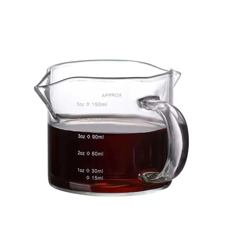 Glass measuring pitcher with handle.