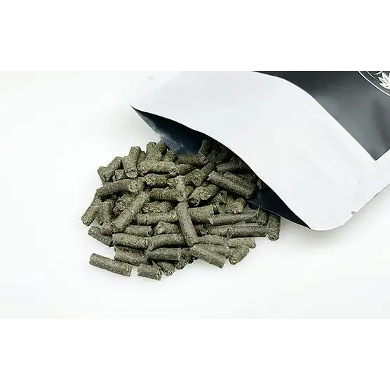 Rabbit food pellets spilling from a bag.