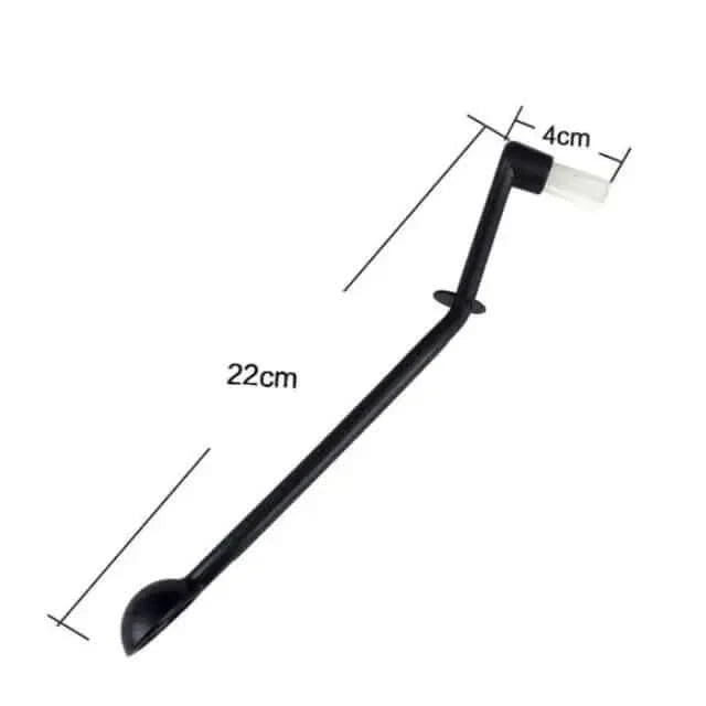 Black plastic spoon-brush tool.