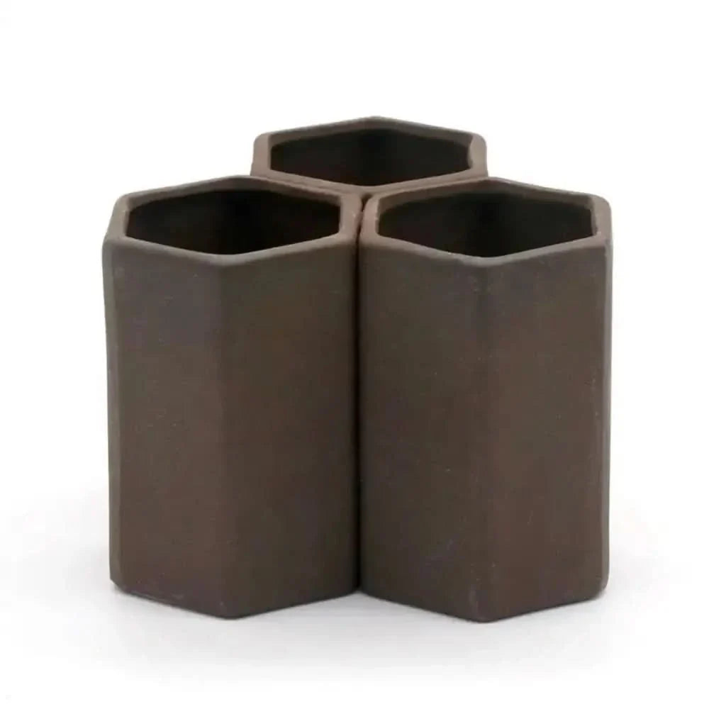 Brown hexagonal pen holder.