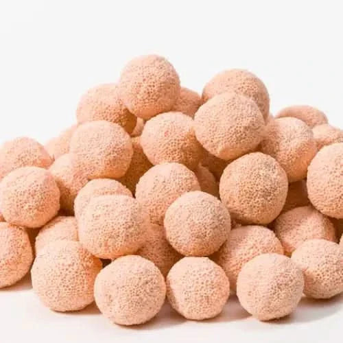 Pile of peach-colored, textured spheres.