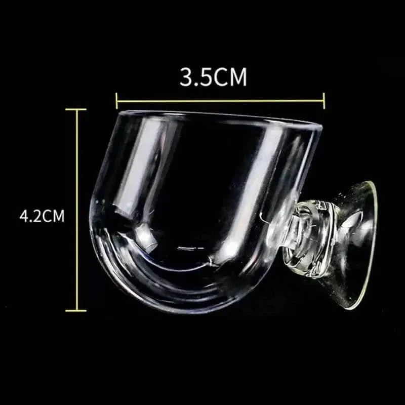 Glass aquarium feeding dish with suction cup.