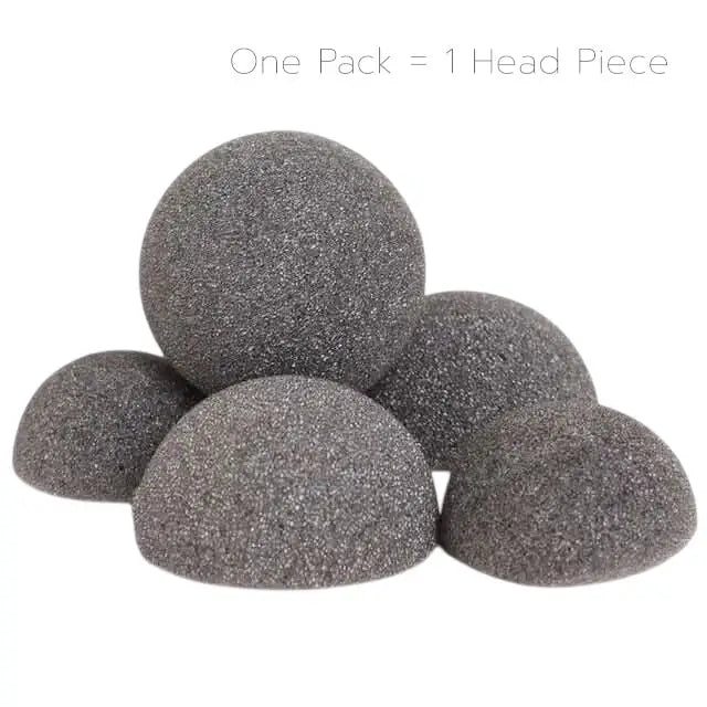 A pile of spherical and hemispherical abrasive grinding media.