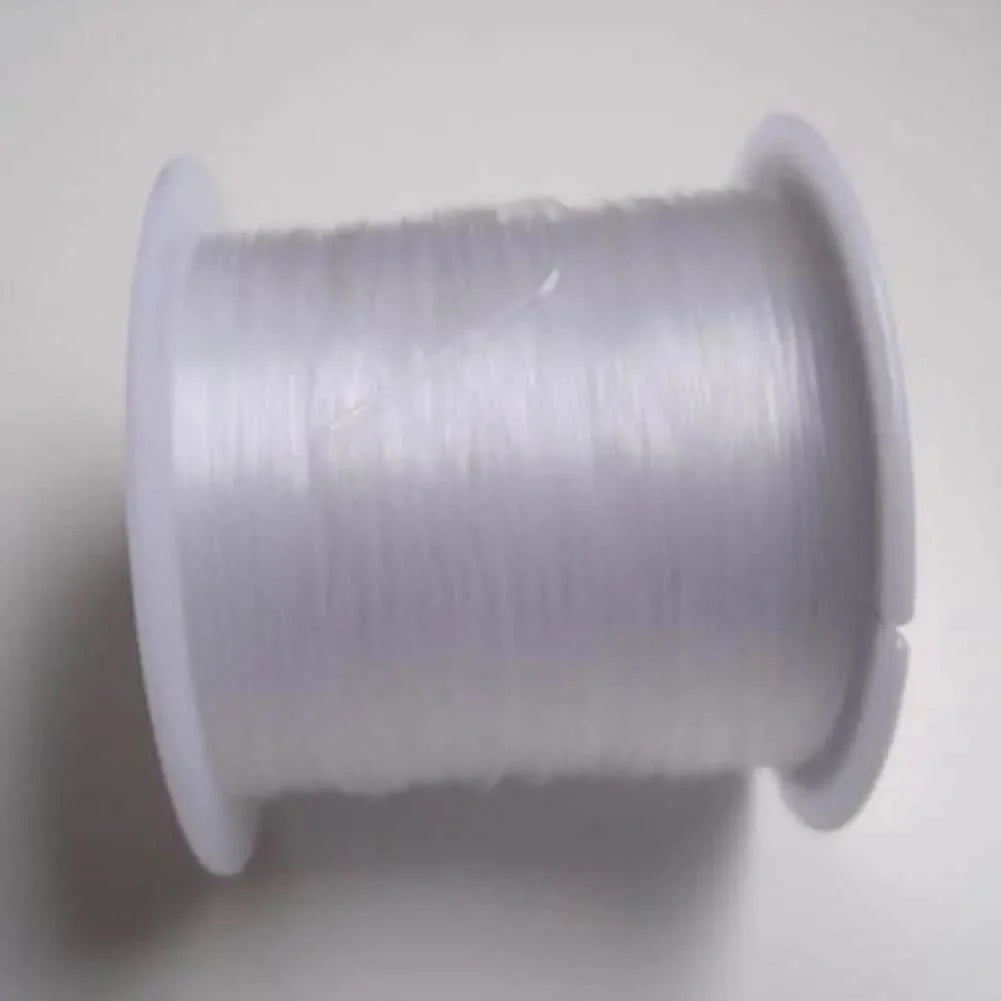 Spool of clear elastic thread.