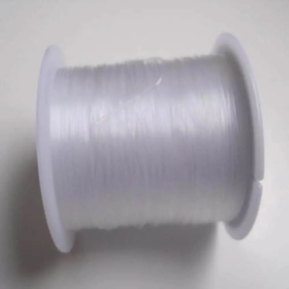 Spool of clear elastic thread.