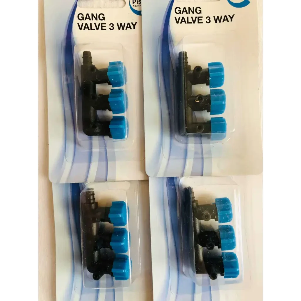 Four packaged, black, three-way gang valves with blue knobs.