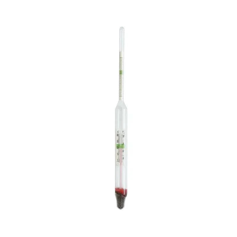 Glass hydrometer with red liquid.
