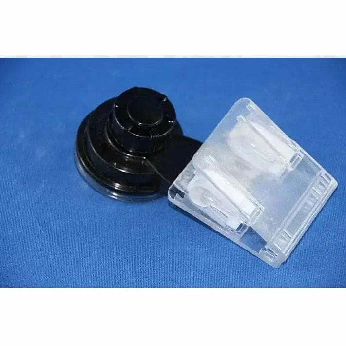 Black suction cup and clear plastic clip.