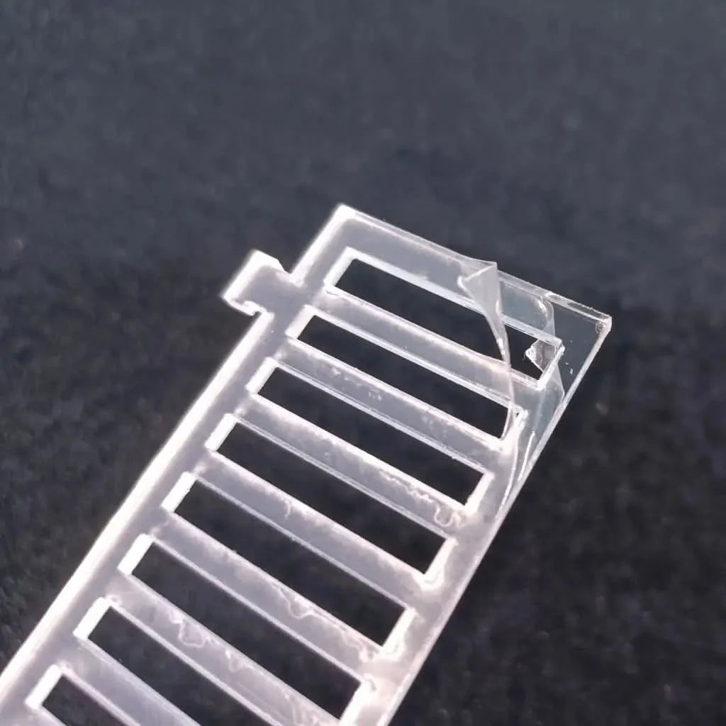 Clear plastic slotted tag.