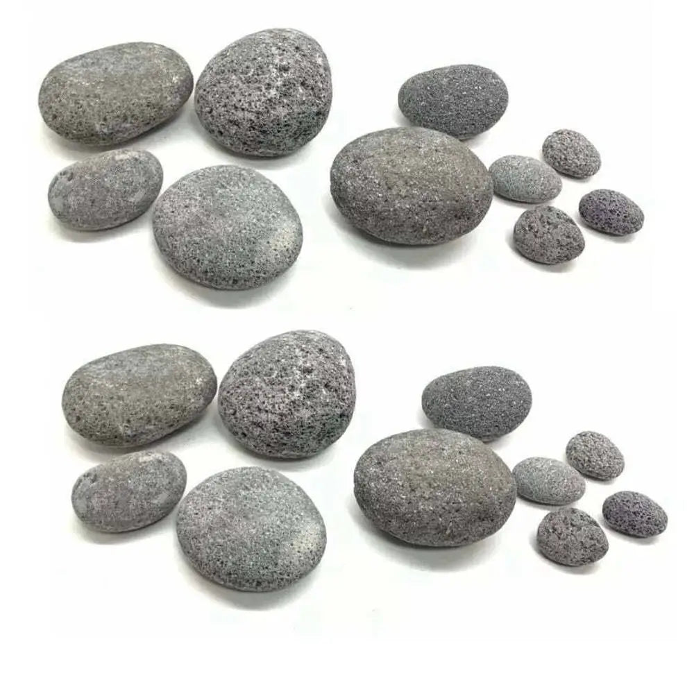A collection of smooth, gray, porous lava rocks.