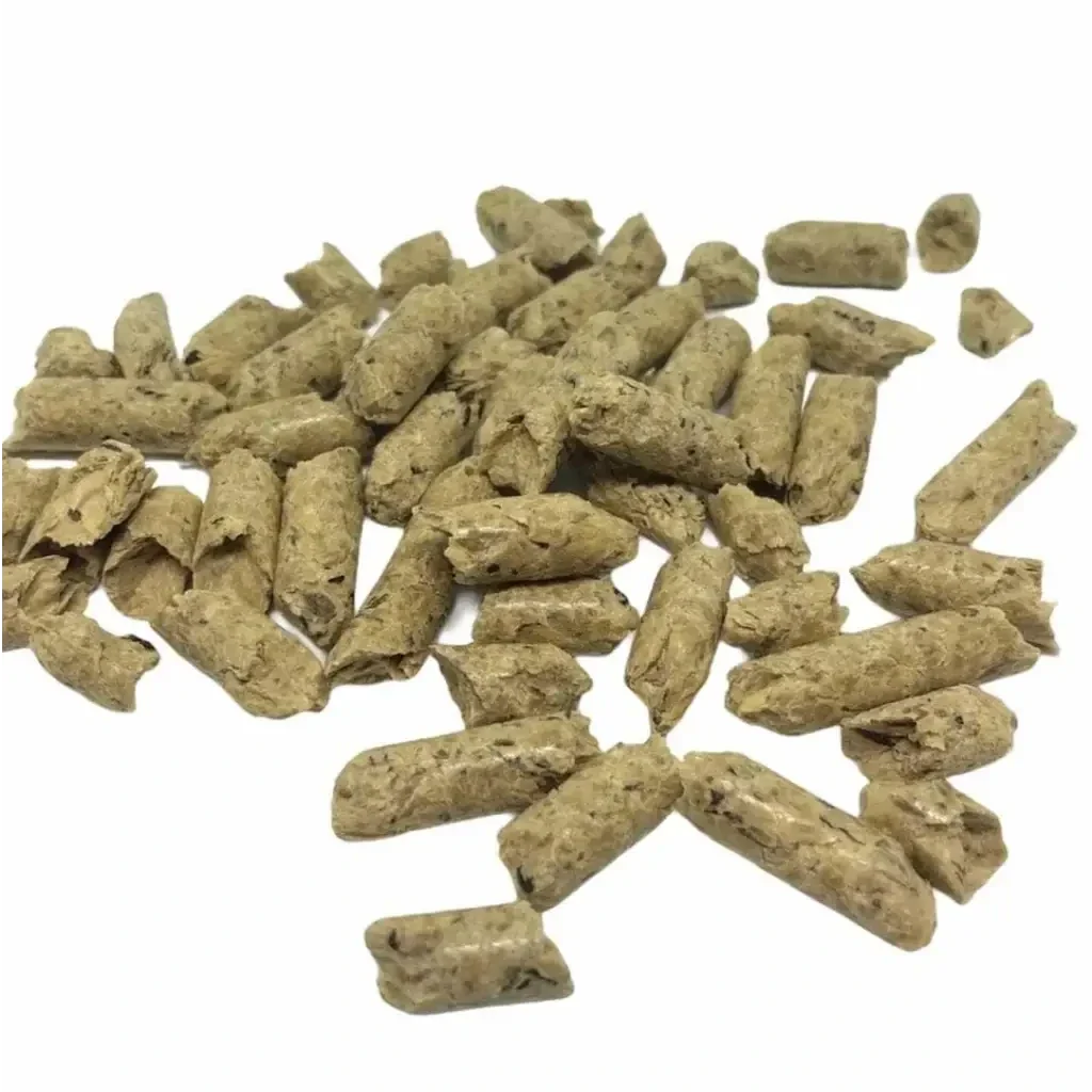 Pile of cylindrical animal feed pellets.