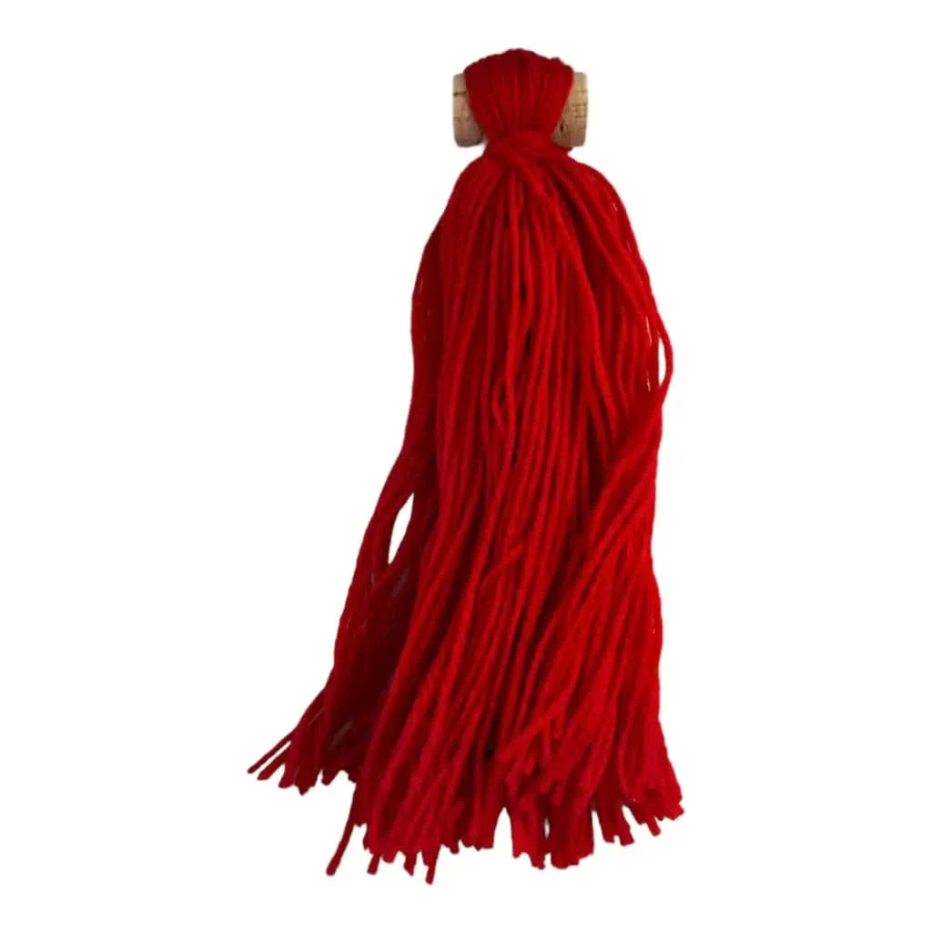 Red yarn tassel.