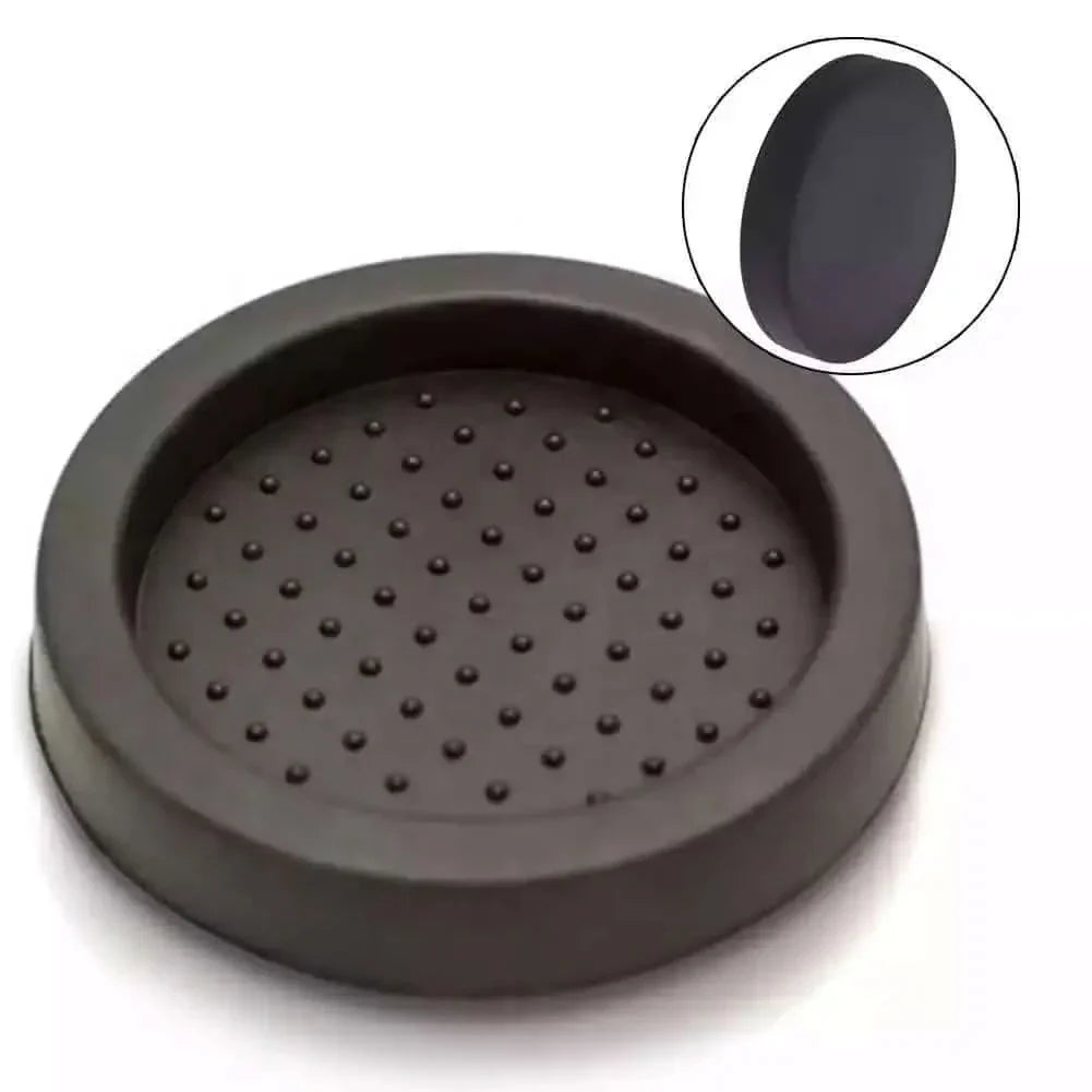 Round, dark gray, rubber furniture coaster with textured surface.