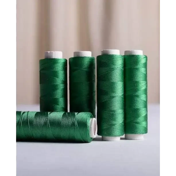 Green spools of thread.