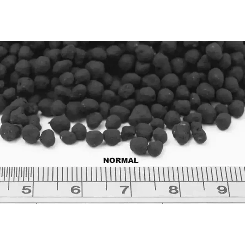 Dark, round fertilizer pellets.