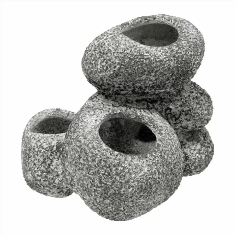Gray stone-like aquarium decoration with holes.