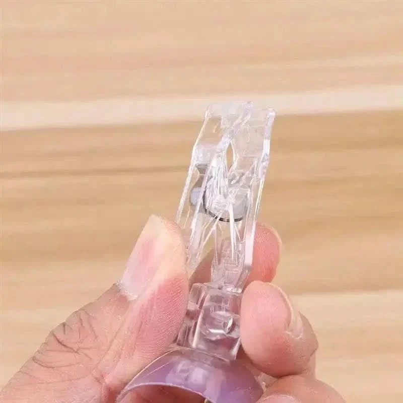 Clear plastic suction cup clip.