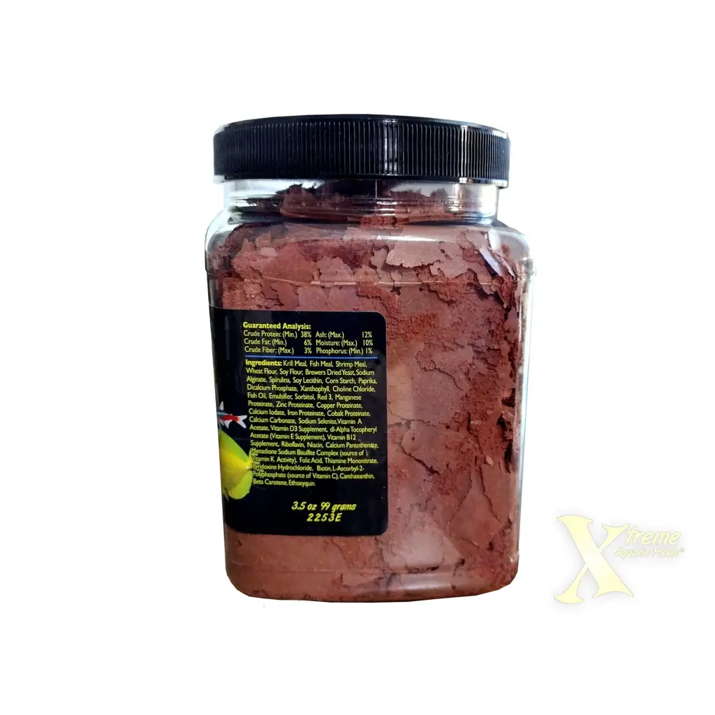 Container of fish food flakes.