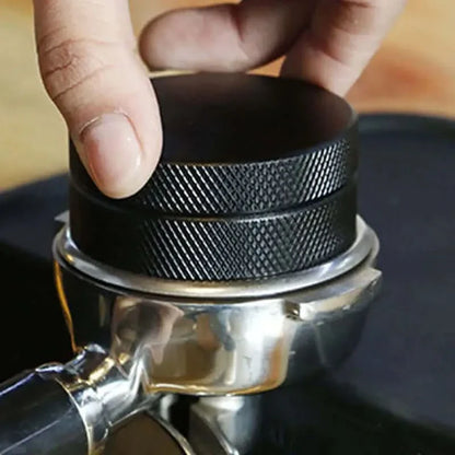 Black metal coffee tamper.