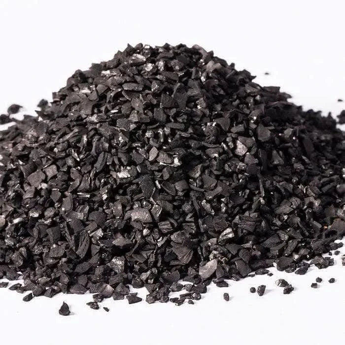 Pile of black granular material.