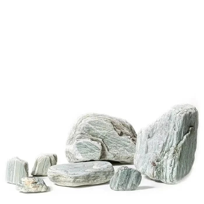 Collection of striated gray rocks.