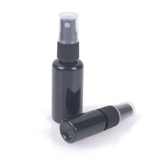Two black spray bottles.