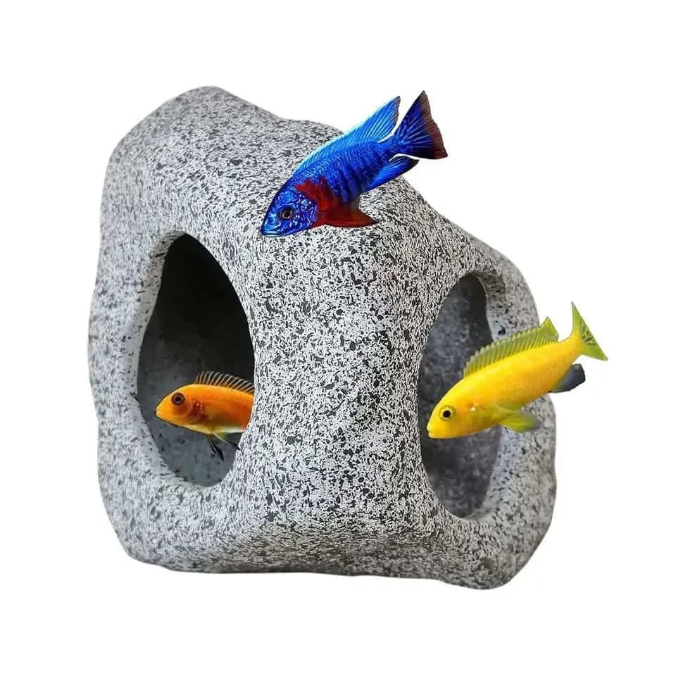 Aquarium rock cave with colorful fish.