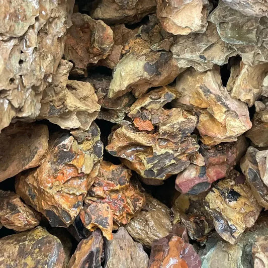 Pile of rough, multicolored rocks.