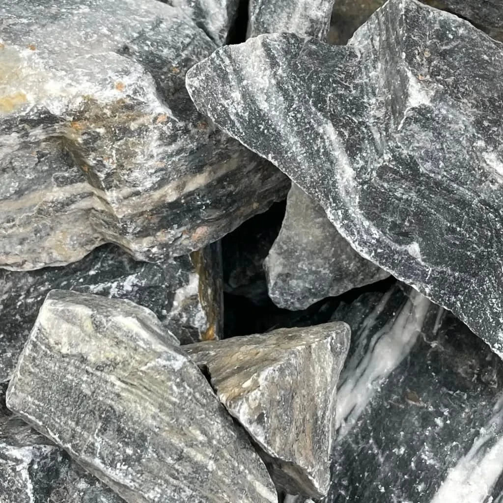 Pile of gray and white striped rocks.
