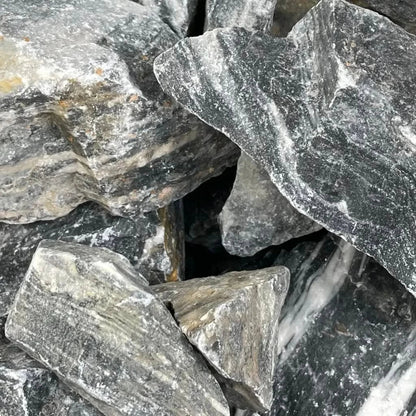 Pile of gray and white striped rocks.