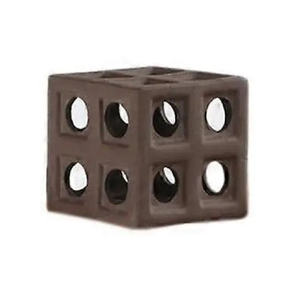 Brown cube with circular openings.