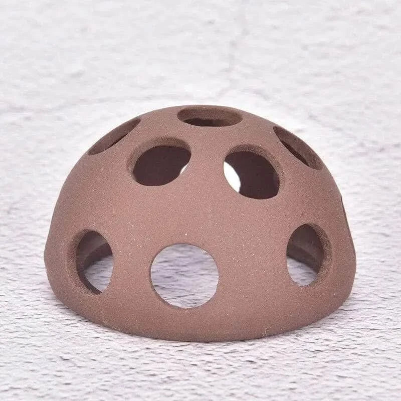 Brown ceramic dome with circular holes.