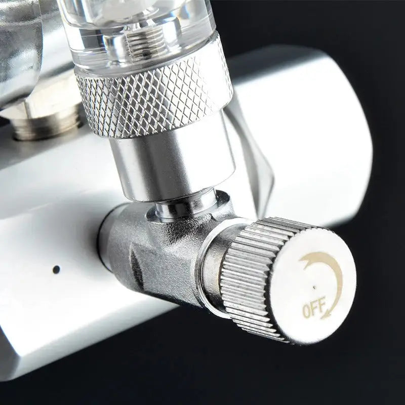 Silver metal valve with knurled knob.