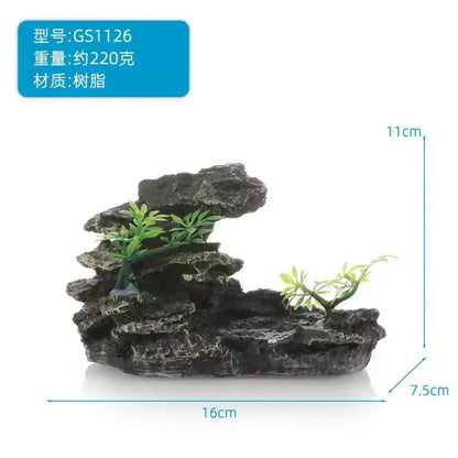 Artificial rock aquarium decoration with plants.