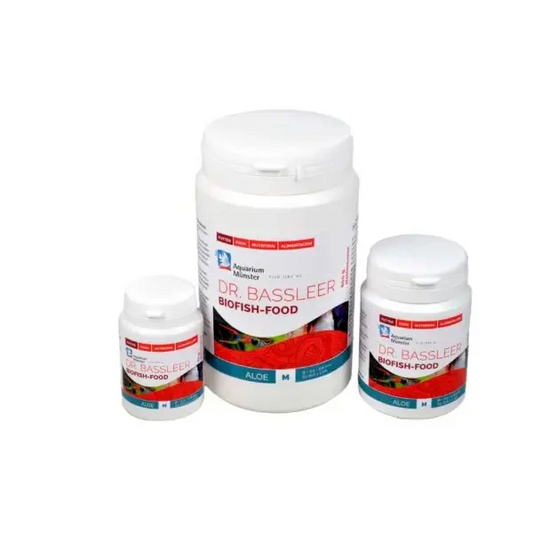 Three white containers of fish food.