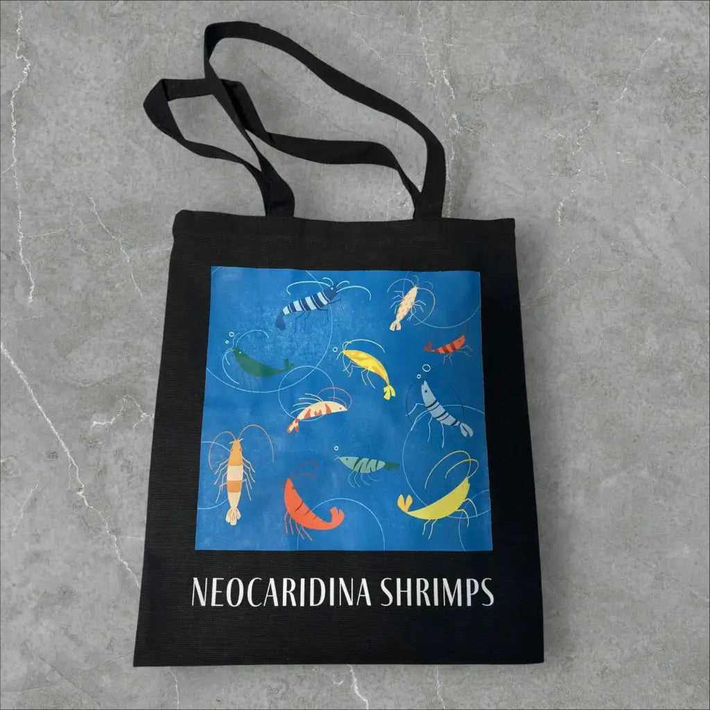 Black tote bag with colorful shrimp illustration.