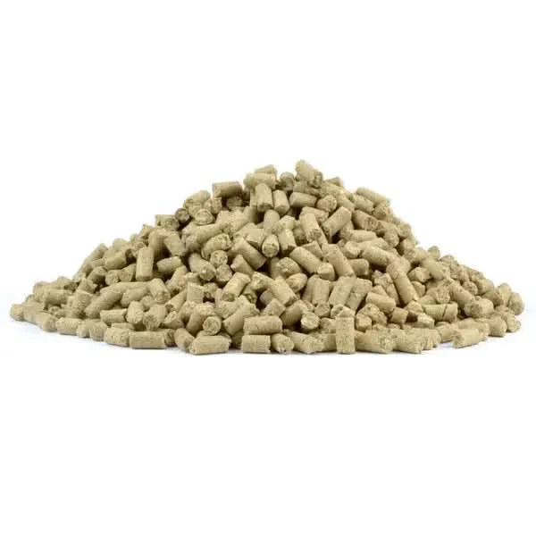Pile of cylindrical animal feed pellets.