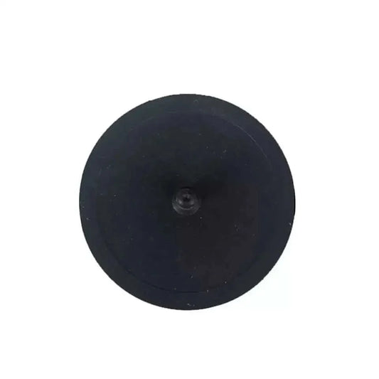 Black circular disc with central hole.