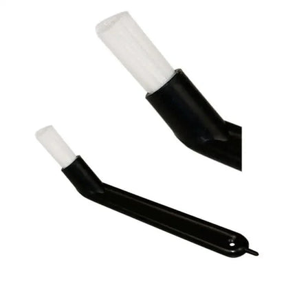 Black espresso machine cleaning brush.
