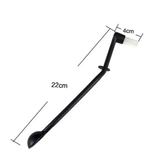 Black plastic spoon-brush tool.