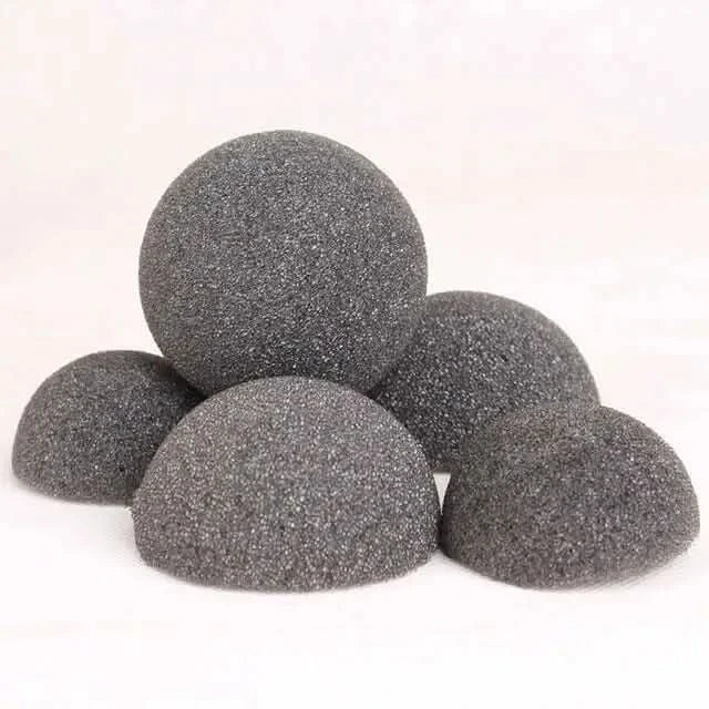 Gray, porous, hemispherical foam shapes.