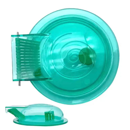 Green plastic pet wheel with suction cup base and brush attachment for hamsters or gerbils.