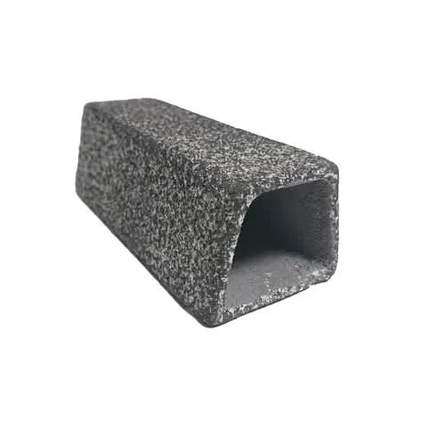 Rough, gray, rectangular tunnel.