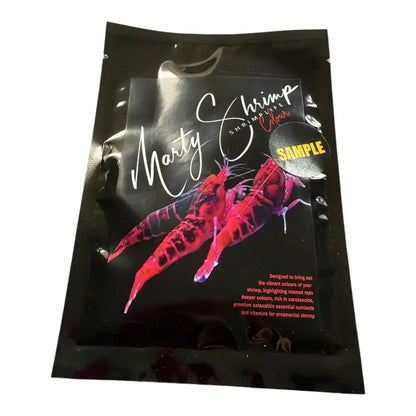 Black pouch of shrimp food with a vivid pink shrimp illustration.