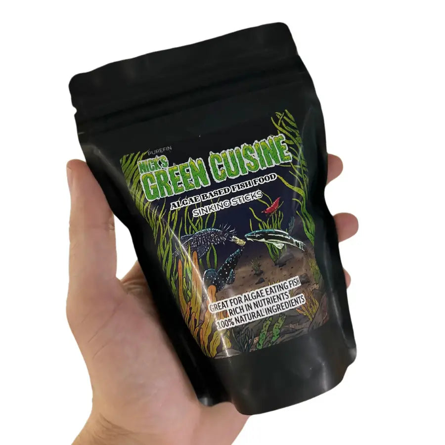 Black resealable pouch of nick’s green cuisine algae-based sinking fish food sticks.