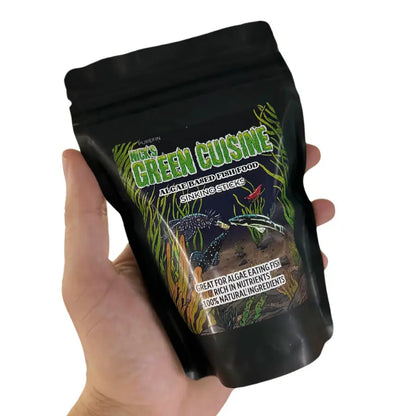 Black resealable pouch of nick’s green cuisine algae-based sinking fish food sticks.